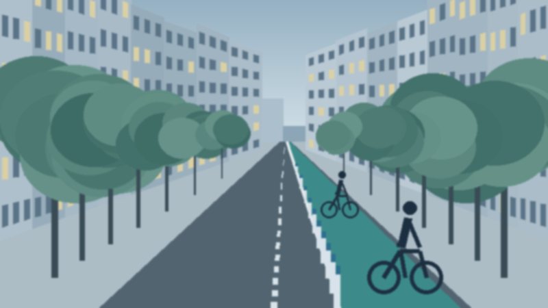 Ciclovía protegida con bolardos a lo largo de una avenida